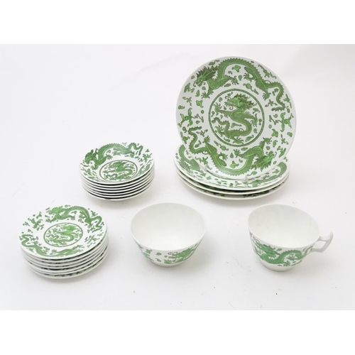 169 - A quantity of tea and dinner wares by Coalport in the pattern Green Dragon, to include plates, sauce... 