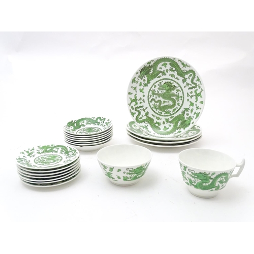 169 - A quantity of tea and dinner wares by Coalport in the pattern Green Dragon, to include plates, sauce... 