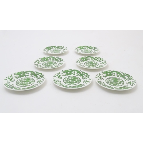 169 - A quantity of tea and dinner wares by Coalport in the pattern Green Dragon, to include plates, sauce... 