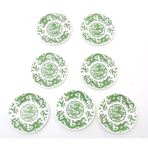 169 - A quantity of tea and dinner wares by Coalport in the pattern Green Dragon, to include plates, sauce... 