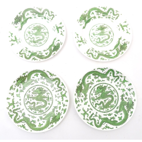 169 - A quantity of tea and dinner wares by Coalport in the pattern Green Dragon, to include plates, sauce... 