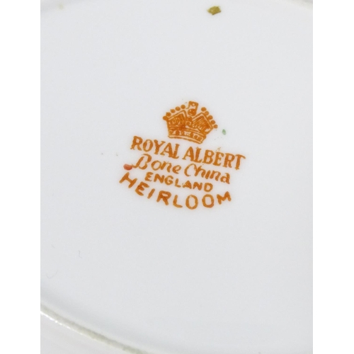 177 - A large quantity of Royal Albert tea and dinner wares in the pattern Heirloom, comprising dinner pla... 