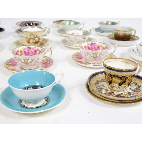 182 - A large quantity of 19thC and later assorted cups and saucers to include Copeland Garrett with hand ... 