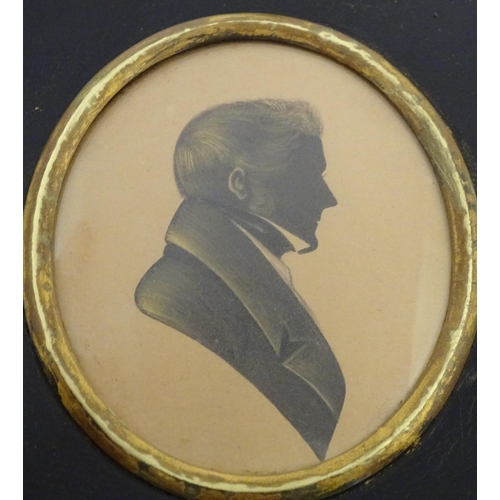 829 - A 19thC oval watercolour silhouette portrait miniature of a man with gilt highlights. Approx. 5 3/4