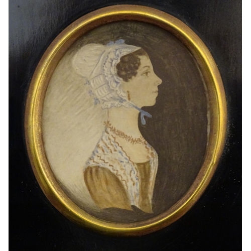 831 - A 19thC oval watercolour portrait miniature depicting a young lady wearing a bonnet. Approx. 6 1/4