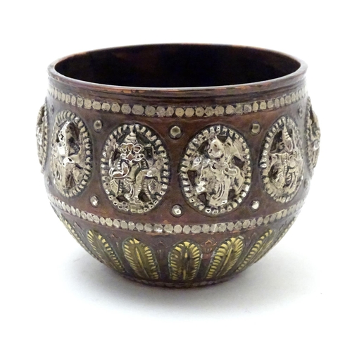 834 - A late 19th / early 20thC small Indian copper bowl with inlaid brass foliate detail and oval medalli... 