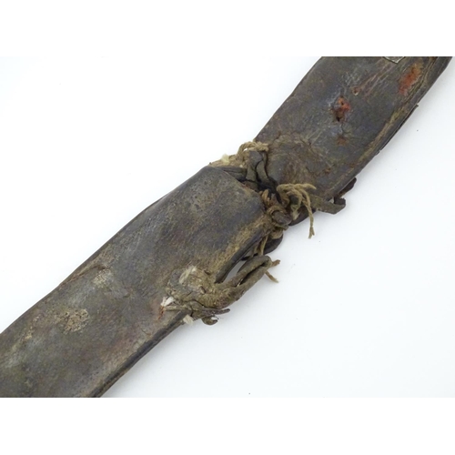 843 - A 19thC sword belt with three steel plaques mounted on leather, possibly Mongolian. Approx. 31