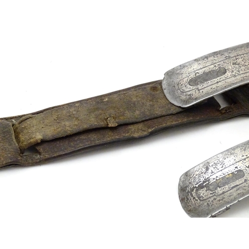 843 - A 19thC sword belt with three steel plaques mounted on leather, possibly Mongolian. Approx. 31