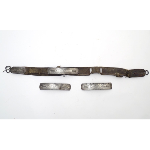 843 - A 19thC sword belt with three steel plaques mounted on leather, possibly Mongolian. Approx. 31