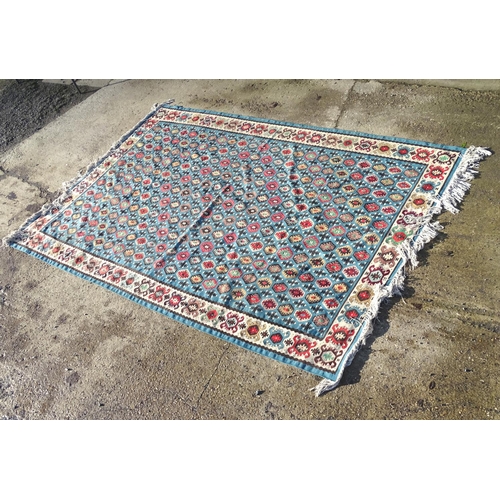 1532 - Carpet / Rug : A large Kilim rug with blue ground having geometric medallion decoration and white bo... 