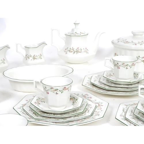 172 - A large quantity of Johnson Brothers tea and dinner wares in the pattern Eternal Beau with flower an... 