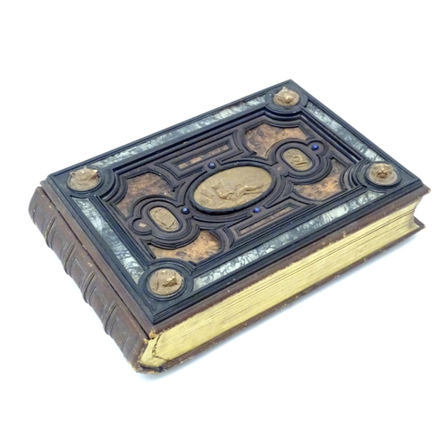 839 - A late 19thC Austrian box formed as a book by Auguste Klein, the cover with inlaid carved panels dep... 