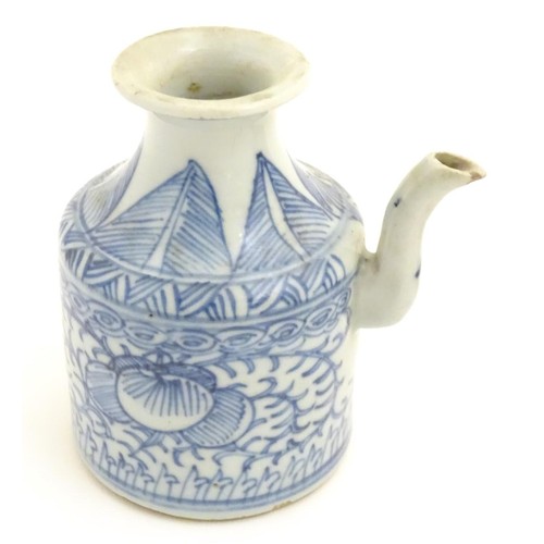 69 - Three Chinese ceramic items comprising a Yixing clay teapot, a blue and white water pot and a model ... 