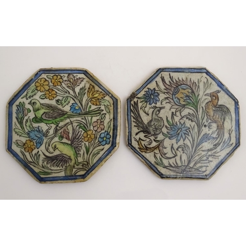 92 - Two Persian tiles of octagonal form decorated with stylised birds and flowers within a blue border. ... 