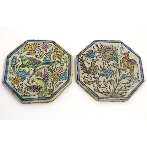 92 - Two Persian tiles of octagonal form decorated with stylised birds and flowers within a blue border. ... 