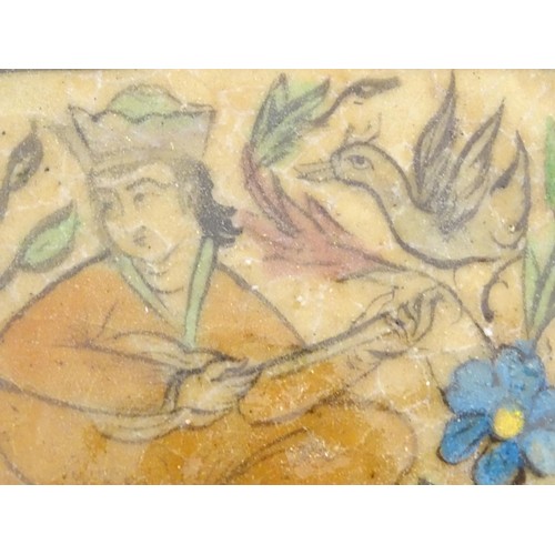 93 - A 19thC rectangular Persian tile with hand painted decoration depicting a seated man playing a music... 