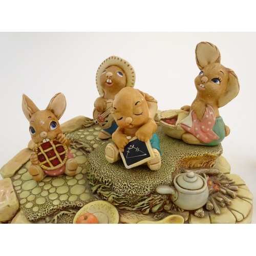 155 - A quantity of Pendelfin rabbit figures and display stand. Tallest figure approx. 4