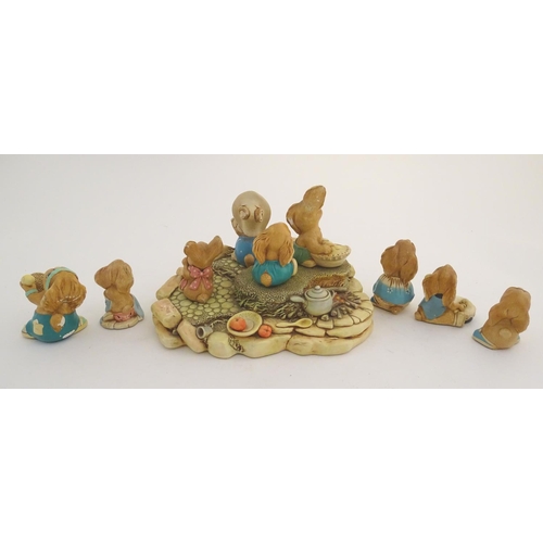 155 - A quantity of Pendelfin rabbit figures and display stand. Tallest figure approx. 4