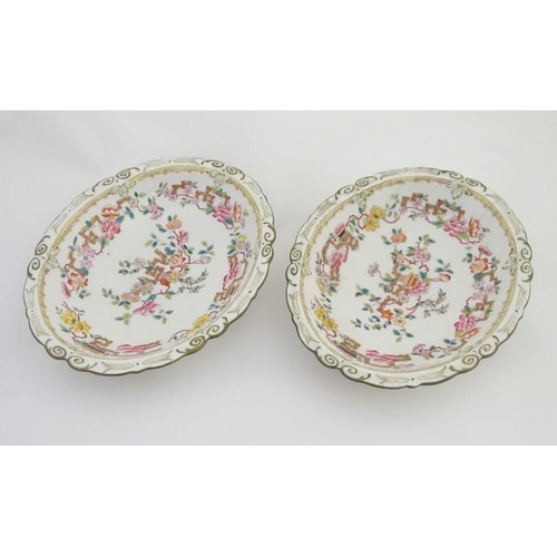 159 - A pair of 19thC oval dishes with hand painted decoration of oriental style stylised scrolling flower... 