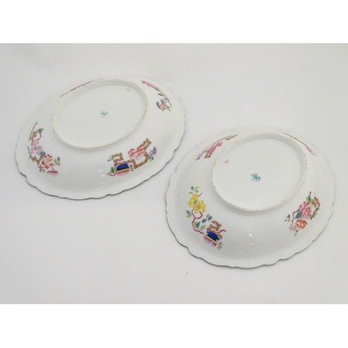 159 - A pair of 19thC oval dishes with hand painted decoration of oriental style stylised scrolling flower... 