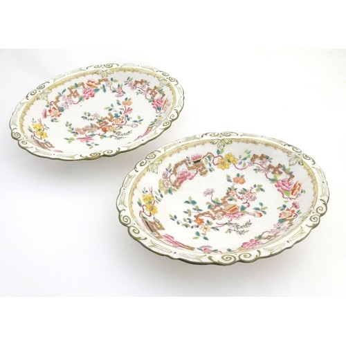 159 - A pair of 19thC oval dishes with hand painted decoration of oriental style stylised scrolling flower... 