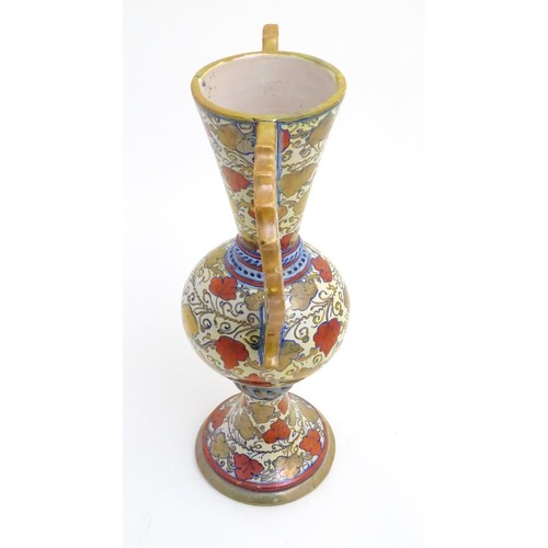 175 - A late 20thC Italian Gu-shaped vase with large wavy edged handles with pierced decoration, decorated... 