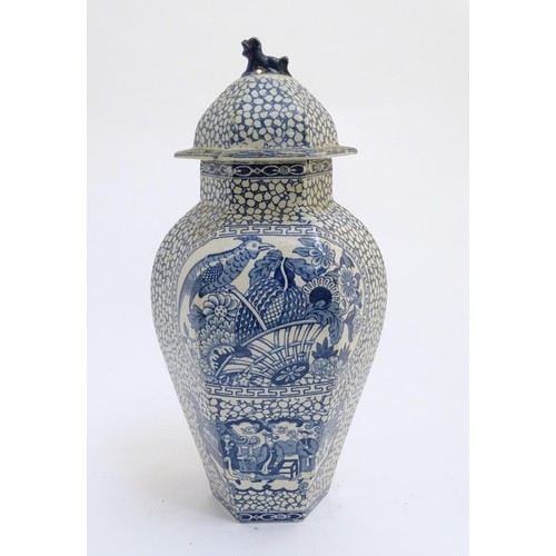 178 - A blue and white hexagonal lidded ginger jar by W. M. Adams, in the pattern Chinese Bird, with panel... 