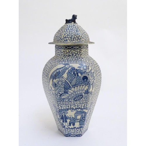 178 - A blue and white hexagonal lidded ginger jar by W. M. Adams, in the pattern Chinese Bird, with panel... 