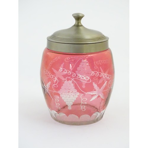 198 - Glass : a wheel cut Cranberry glass flashed biscuit barrel with grape and tendril decoration, with s... 