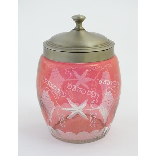 198 - Glass : a wheel cut Cranberry glass flashed biscuit barrel with grape and tendril decoration, with s... 