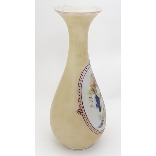 200 - A late 19th / early 20thC Continental milk glass vase with hand painted enamel decoration depicting ... 