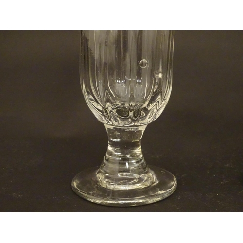 212 - Drinking glasses : A 19thC glass rummer together with a fluted ale glass. Tallest approx 5 1/4