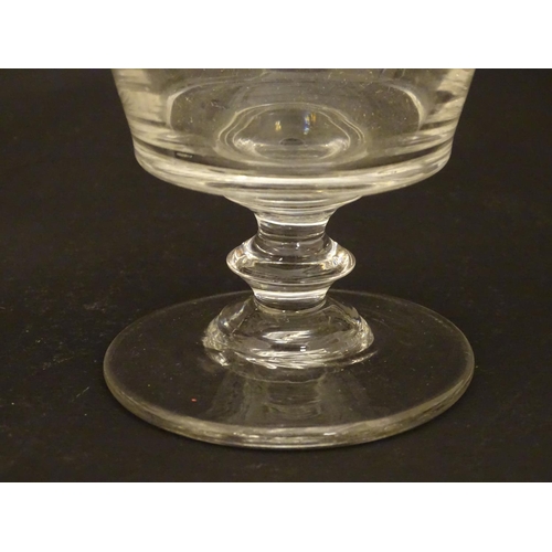 212 - Drinking glasses : A 19thC glass rummer together with a fluted ale glass. Tallest approx 5 1/4