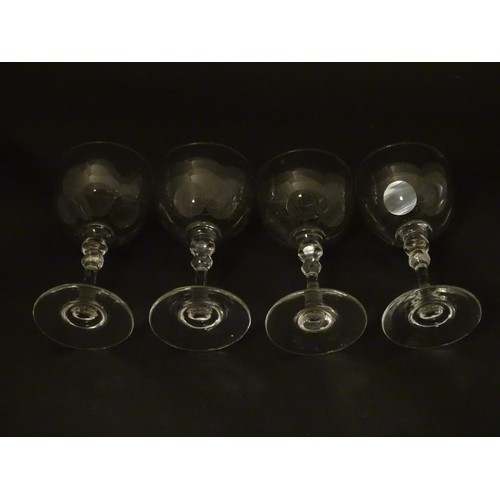 230 - Georgian glasses: a set of four facet cut pedestal glasses with ground pontil scars under, each 4 3/... 