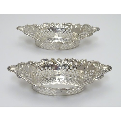 239 - A pair of silver plate bon bon dishes with pierced decoration. Approx. 6