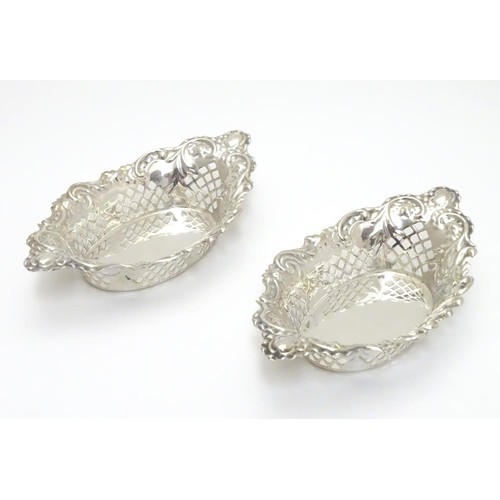 239 - A pair of silver plate bon bon dishes with pierced decoration. Approx. 6