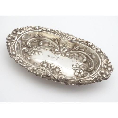 285 - A silver dish with embossed decoration, hallmarked London 1984 maker BJS. 5 1/2