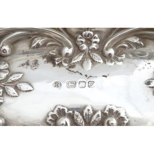 285 - A silver dish with embossed decoration, hallmarked London 1984 maker BJS. 5 1/2