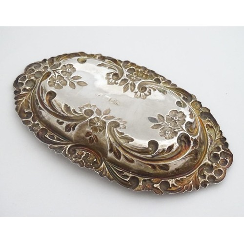 285 - A silver dish with embossed decoration, hallmarked London 1984 maker BJS. 5 1/2