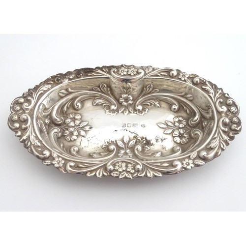 285 - A silver dish with embossed decoration, hallmarked London 1984 maker BJS. 5 1/2