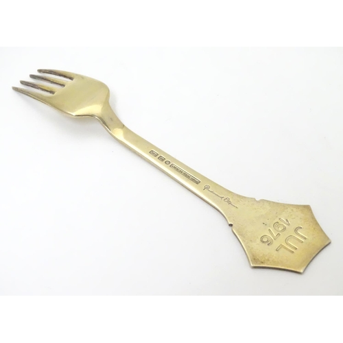 374 - A Danish sterling silver gilt and enamel 1976 Christmas fork with Snow Crystal design. Maker A. Mich... 