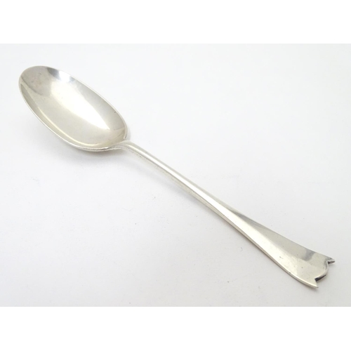 450 - Silver rat-tail dessert spoon with unusual shaped handle. Hallmarked Sheffield 1929 maker William Hu... 