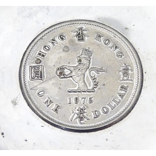 452 - A Chinese Export silver pin dish of circular form with inset  QEII Hong Kong Dollar to centre.  3 1/... 