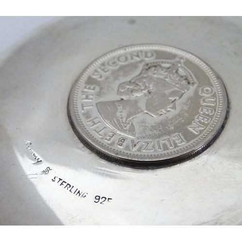 452 - A Chinese Export silver pin dish of circular form with inset  QEII Hong Kong Dollar to centre.  3 1/... 