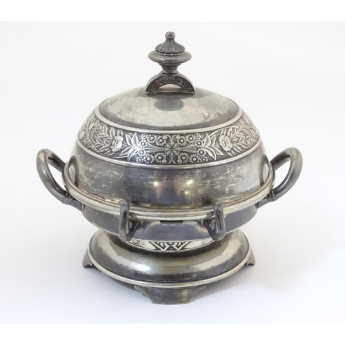 480 - An American silver plated twin-handled butter dish with embossed foliate decoration, the hinged lid ... 