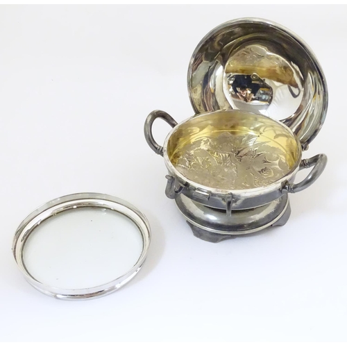 480 - An American silver plated twin-handled butter dish with embossed foliate decoration, the hinged lid ... 