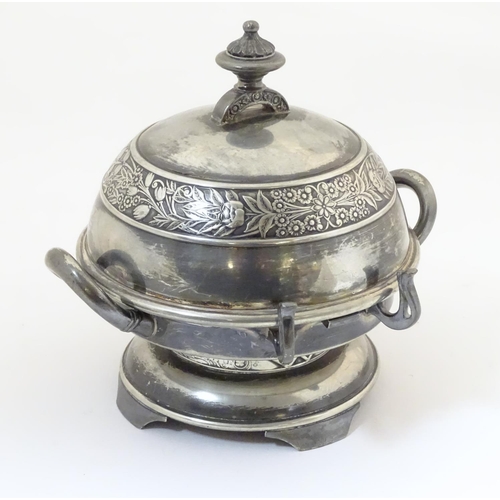 480 - An American silver plated twin-handled butter dish with embossed foliate decoration, the hinged lid ... 