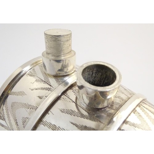 488 - A 21stC novelty silver plated spirit flask, the base formed as a bear laying on a sled supporting a ... 