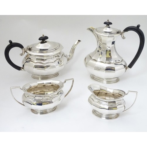 493 - A silver plate 4 piece tea set comprising teapot, hot water pot, sugar and cream jug (4)