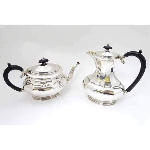 493 - A silver plate 4 piece tea set comprising teapot, hot water pot, sugar and cream jug (4)